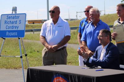 an image of leaders and the new bypass sign 