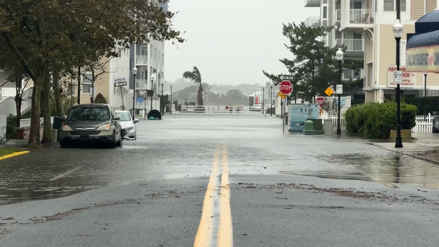 Looking down a flooded roadway.