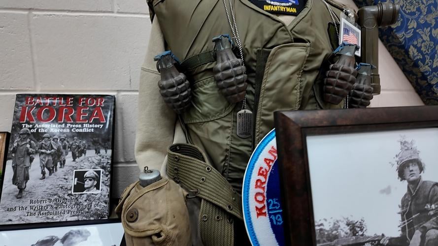 Walter Koopman's armored vest and water can from Korean War.
