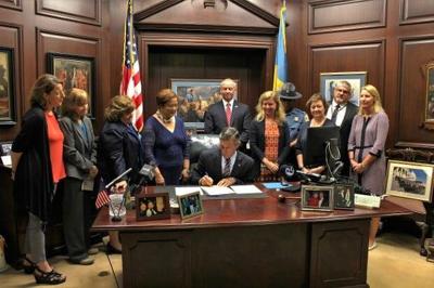 Governor Carney signs legislation to prevent child abuse