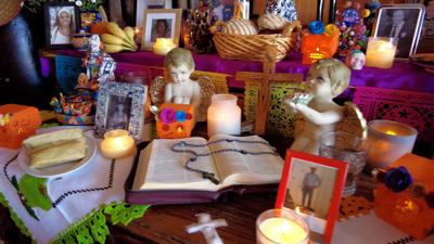 At La Tonalteca restaurant in Millsboro, tamales, oranges, fresh bread, and Coke were among the favorite foods and beverages placed on the altar to honor those who have passed.