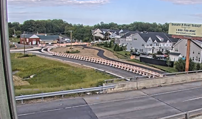 An aerial view of the roundabout off of Route 1, lined with orange cones.