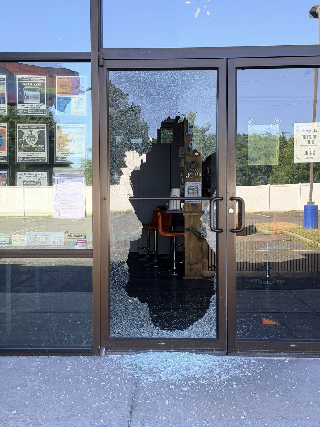 Damage to the front door of The Listening Booth following a burglary reported on Saturday, May 30, in Lewes. (Marissa Levy)
