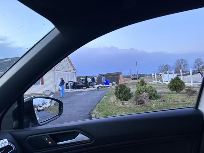 A roof on the ground and siding torn off a house in Ellendale just before 8 p.m.