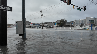 Standing water at the intersection of a roadway.