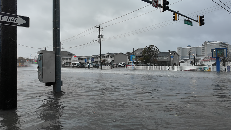 Standing water at the intersection of a roadway.