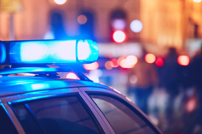 A police car with blue and red lights lit up