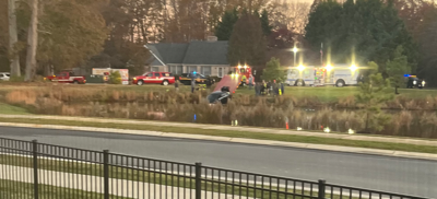 Car drives into retention pond