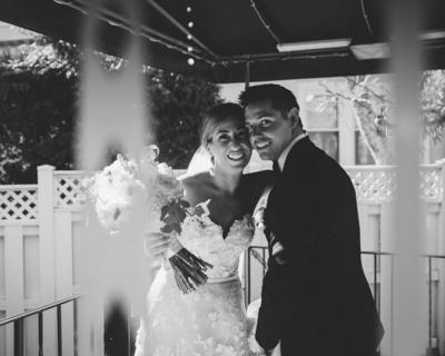 A couple pose together on their wedding day.