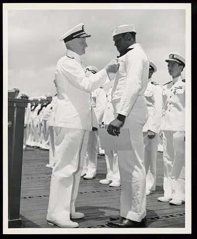 Dorie Miller receiving Navy Cross from Admiral Nimitz