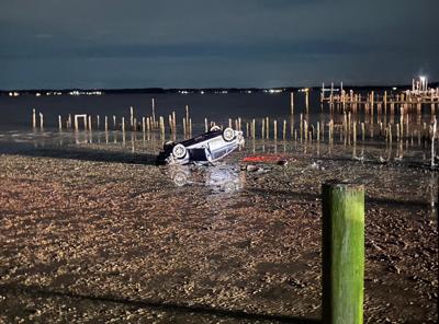 Car overturns in bay