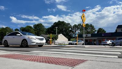 New crosswalks with cars passing on Route 26 in Bethany Beach.
