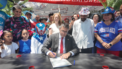 Delaware Gov. Matt Meyer signs House Bill 290 into law, officially designating June 11 as Puerto Rico Day in Delaware.