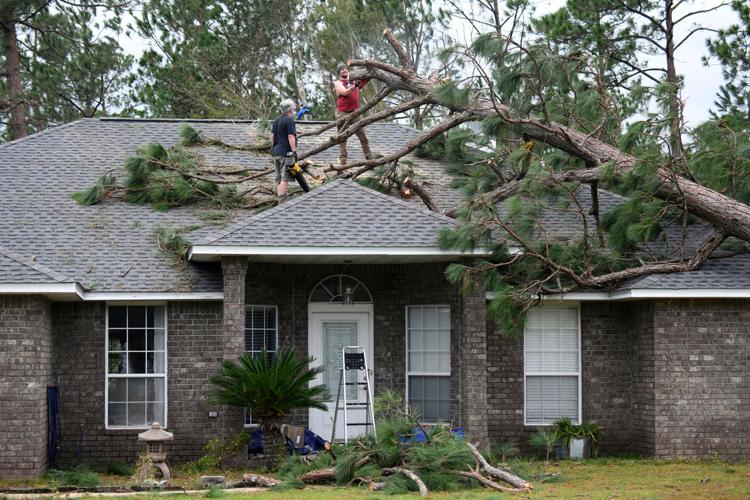 Isaias leaves trail of damage as it moves inland, in photos