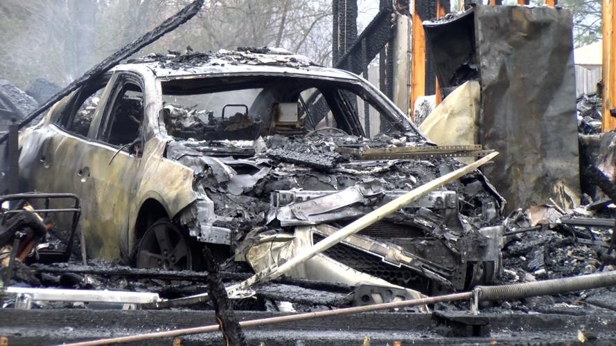 A vehicle in the home was also burned.