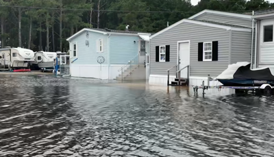 Floodwaters surround a home