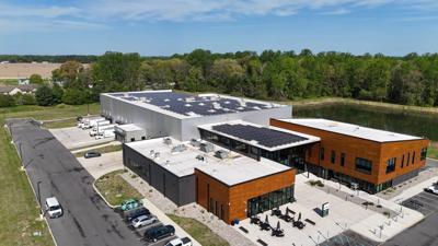 Aerial view of solar panels on top of the Milford Food Bank building.