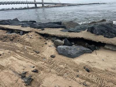 Storm damage sand and rocks on the south side of the Indian River Inlet.