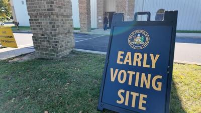 A sign that says "early voting site" outside.