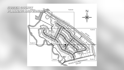 Neighbors showing opposition to proposed housing development outside of Milton
