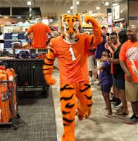 Clemson mascot brings championship trophy to Columbia