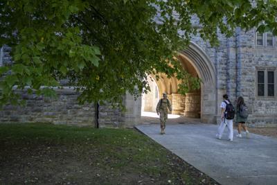 Students walk around campus on an early fall day
