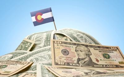 Pile of money with Colorado flag (copy)