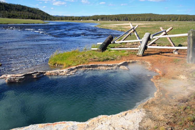 Maiden's Grave Hot Spring near Firehole River. Photo Credit: htrnr (iStock).