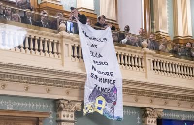 Protesters' banner inside the House chamber