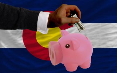 Colorado money dollars piggy bank revenue