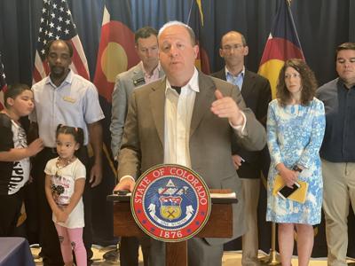 Polis tax bill signing