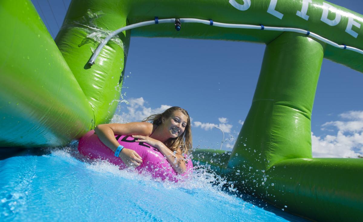 Colorado Springs resident splash their way along giant water slide