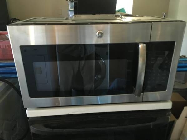 GE over the stove stainless microwave $150 30 day warranty ph 541 298 2687 image 2