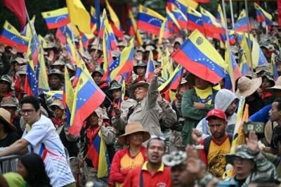 Members of the Bolivarian National Militia, part of Venezuela's armed forces, hold a rally in Caracas