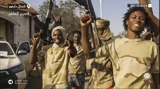An image taken from handout video footage released by Sudan's paramilitary Rapid Support Forces showing its fighters celebrating in the streets of El-Fasher after an 18-month siege