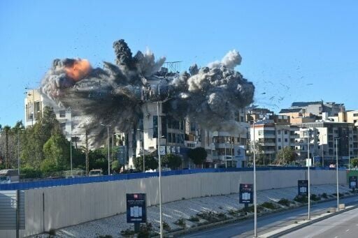 An Israeli strike hits a building adjacent to the highway leading to Beirut's international airport