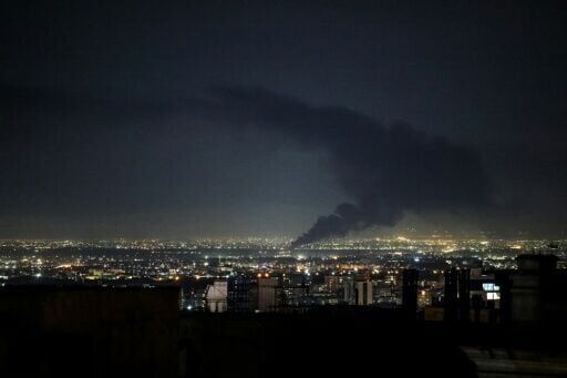 Smoke rises from the site of a US-Israeli strike on the Iranian capital Tehran before the ceasefire was struck