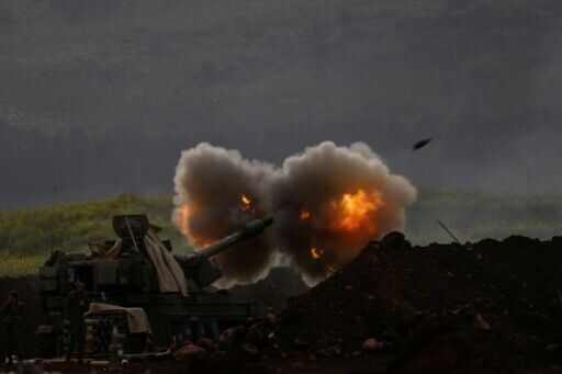 An Israeli artillery in northern Israel fires towards southern Lebanon