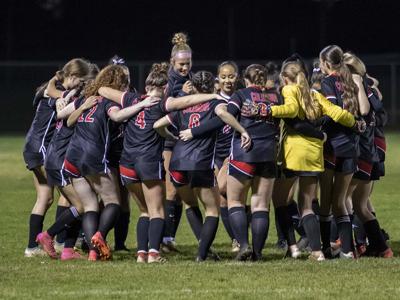 The Columbia Bruins girls soccer team gets excited before a match last year.  Noah Noteboom photo