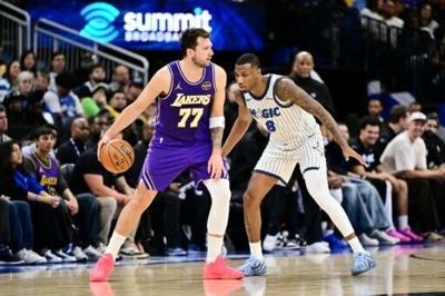 Luka Doncic (left) has been cleared to face the Detroit Pistons after a foul which triggered an automatic suspension was rescinded