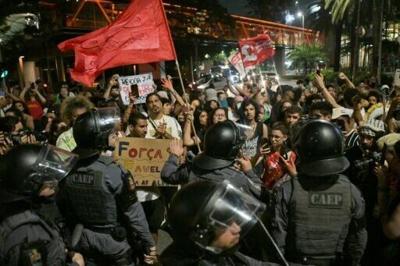 Activists protest against river dredging in the Amazon outside the Sao Paulo headquarters of US agribusiness giant Cargill