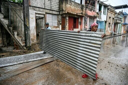 Residents prepare for the arrival of Hurricane Melissa in the Cuban city of Santiago de Cuba, on October 28, 2025
