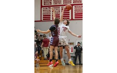 Caleb Reynolds (13) wins the tipoff against Stevenson on Jan. 15.