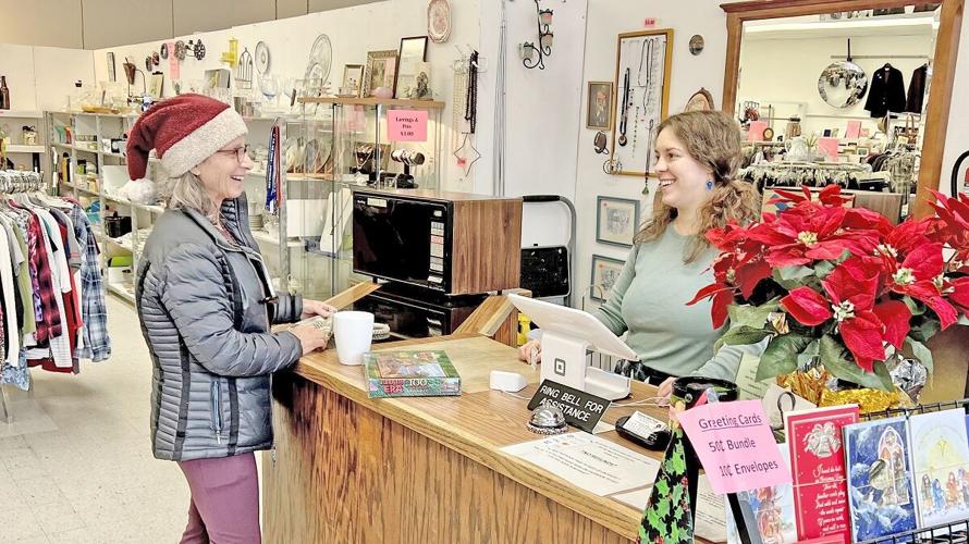 Community member Andi Andree says she loves shopping at Second Hand Rose and her favorite item is puzzles. She works on them with her grandkids and then donates them again when she comes back for more. Photo by Tamara Kaufman