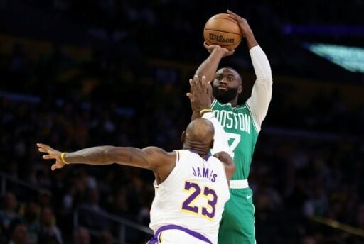 Boston's Jaylen Brown attempts a shot against LeBron James in the Celtics' NBA victory over the Los Angeles Lakers