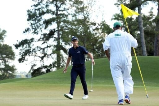England's Justin Rose reacts to making a birdie at the eighth hole that helped put him in the lead in the final round of the Masters