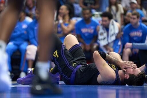 Los Angeles Lakers star Luka Doncic reacts after suffering a left hamstring injury in the Lakers' NBA loss to the Oklahoma City Thunder