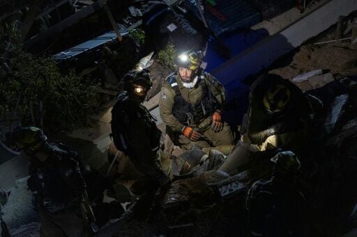 The Israeli military and medics said a missile fired from Iran hit a residential building in the northern city of Haifa