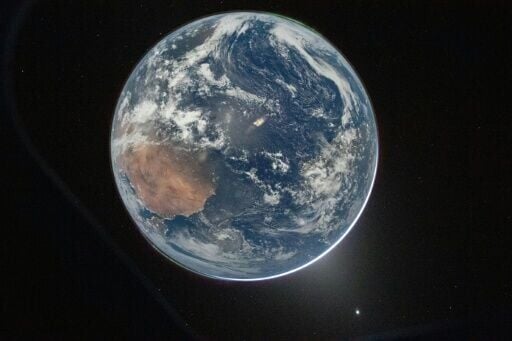 This NASA handout picture taken by Artemis 2 commander Reid Wiseman shows Earth as seen from the Orion spacecraft as it travels toward the Moon