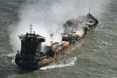 Smoke rises from the MV Solong cargo ship in the North Sea, off the east coast of England, on March 11, 2025, a day after it collided with the MV Stena Immaculate tanker